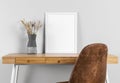 frame mock up table beside vase. High quality photo Royalty Free Stock Photo