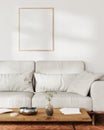 frame mock up on white wall with sunlight in living room interior with gray sofa and coffee table with decor, 3d