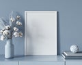 Frame mockup in a blue interior with a chest of drawers, a va