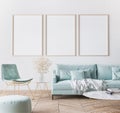 Frame mockup in bright modern living room design, three vertical wooden frames Royalty Free Stock Photo