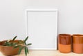 Frame mockup, earthenware glazed crockery, olive tree branch on white background, styled image for social media Royalty Free Stock Photo