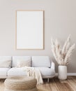 Frame mockup in farmhouse living room design, white furniture on bright wall background Royalty Free Stock Photo
