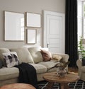 Frame mockup in home interior, living room in neutral colors with sofa, armchair and dry flower on table