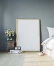 Cozy bedroom with empty poster frame. Frame mockup in interior. Royalty Free Stock Photo