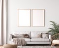 Frame mockup in living room design, two wooden frames in Scandinavian interior Royalty Free Stock Photo