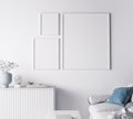 Frame mockup in modern living room design, three frames on bright white wall