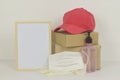 Frame mockup with packaging boxes, Alcohol Hand Gel bottle, medical rubber gloves and mask on white background