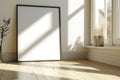 Frame mockup picture on wood floor against white wall, detail of modern minimalist room interior with blank poster and plant. Royalty Free Stock Photo