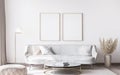 Frame mockup in stylish white modern living room interior, home decor Royalty Free Stock Photo