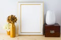 Frame mockup with vases, wooden box and golden flower pot