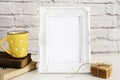 Frame Mockup. White Frame Mock Up. Yellow Cup Of Coffee With White Dots, Cappuccino, Latte, Old Books, Cookies. Display Mock-Up