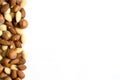 Frame of nuts on a white background. Free space for text.