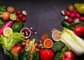 Frame of organic foods on a black background. Fresh vegetables, fruits,cereals and legumes.Vegan and vegetarian concept.Top view,