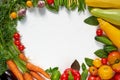 Frame of organic raw vegetables, herbs and spices on the white table. Healthy vegetarian diet food background. Top view