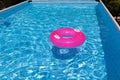 Frame outdoor swimming pool. Inflatable swimming circle on the water surface. Summer, sunny day Royalty Free Stock Photo