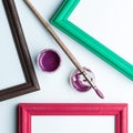 Frame, painbrushe and acrilic paint. Royalty Free Stock Photo