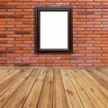 Frame photo on red brick wall and wood perspective. Royalty Free Stock Photo