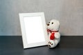 Frame for a photo and a teddy bear toy Royalty Free Stock Photo