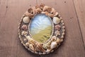 Frame picture made from shells. seas in the frame.