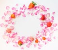 A frame with pink rose petals, sugar stars, strawberries, french Royalty Free Stock Photo