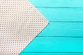 Frame of polka dots texture on blue wooden table. Top view and copy space. Mock up