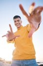 Frame, portrait and a man with hands at the beach with happiness, freedom and creativity. Smile, holiday and a young Royalty Free Stock Photo