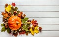 Frame. Pumpkins, maple leaves and chestnuts on a wooden background. Congratulation Royalty Free Stock Photo