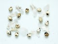 Frame with quail eggs, feathers and and golden glitter Royalty Free Stock Photo