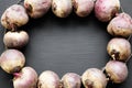 Frame of raw beetroot on black background, top view. Royalty Free Stock Photo