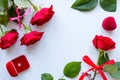Frame of red roses, leaves and wedding rings mockup Royalty Free Stock Photo