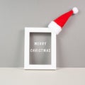 Frame with red Santa Claus hat, winter greeting card, merry christmas Royalty Free Stock Photo