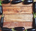 Frame of ripe blue eggplant on wooden boards