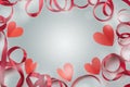 Frame of satin red ribbon heart gray background concept of Valentine's day