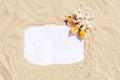 Frame with seashells and coral on golden sandy beach. Summer vacation concept with copyspace for text message Royalty Free Stock Photo