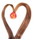 Frame in shape heart strands hair with apple inside isolated. Royalty Free Stock Photo