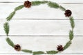 Frame in the shape of an oval of twigs of a Christmas tree on a Royalty Free Stock Photo