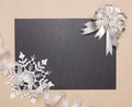 Frame with silver bow and snowflake Royalty Free Stock Photo