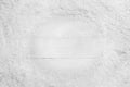 Frame of snow on white wooden , top view with space for text. Christmas season Royalty Free Stock Photo