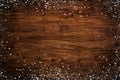 Frame of snowflakes on dark wooden structure Royalty Free Stock Photo