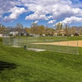 Frame Square Baseball field with view of mountain and cloudy blue sky on a sunny day Royalty Free Stock Photo