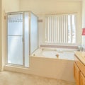 Frame Square Interior of a bathroom with built in bathtub vanity area and separate shower