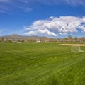 Frame Square Soccer field and baseball field with view of mountain and cloudy blue sky Royalty Free Stock Photo