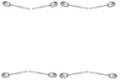 Frame of steel teaspoon on white background