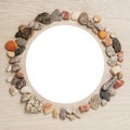 Frame of stones with white circle in the middle on unique backing Royalty Free Stock Photo