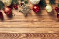 Frame top border with vintage Christmas ornaments and fir branches on rustic wooden desk table top view. Happy New Year greeting Royalty Free Stock Photo