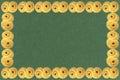 Frame of traditional Swedish and scandinavian Christmas saffron buns Lussekatter on green background, horizontal, copy space