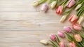 Frame of tulips on rustic wooden background with copy space for greetings card Royalty Free Stock Photo