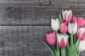 Frame of tulips on rustic wooden background with copy space for Royalty Free Stock Photo