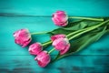 Frame of tulips on turquoise rustic wooden background. Spring flowers. Neural network AI generated Royalty Free Stock Photo