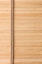 Frame of two smooth ropes lying on a bamboo mat Royalty Free Stock Photo